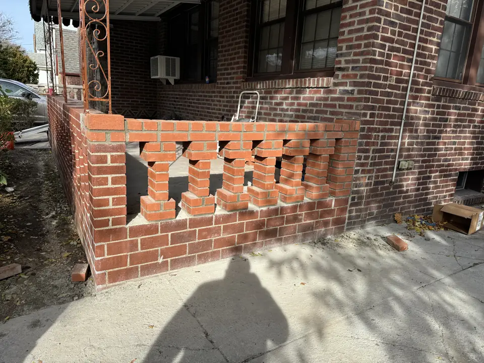 Rebuilt decorative brick porch wall