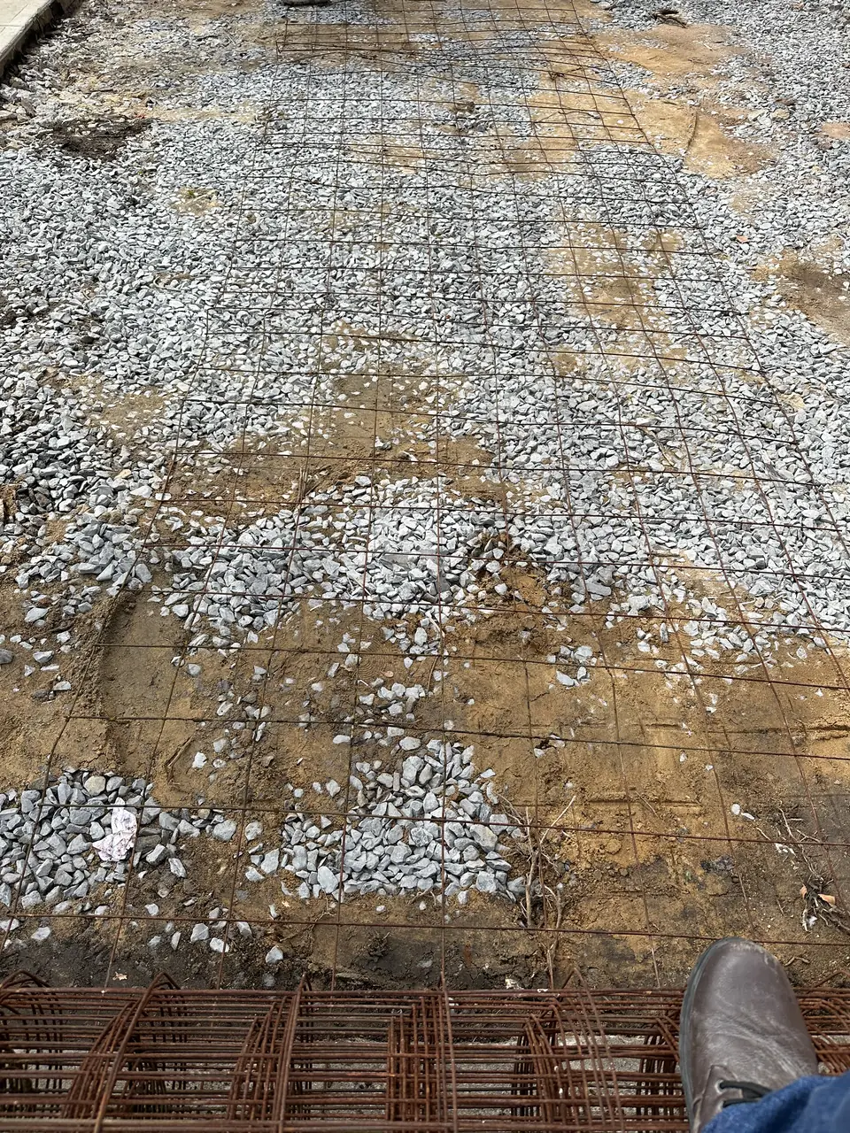 Stone base and steel reinforcement set before a concrete pour
