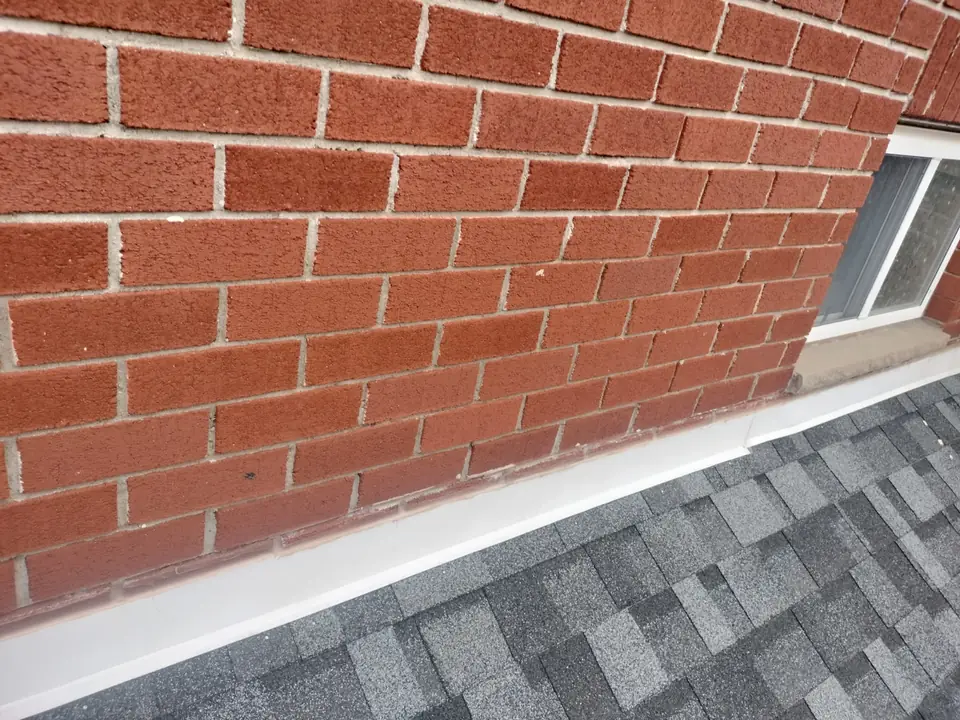 Clean, freshly pointed red brick wall
