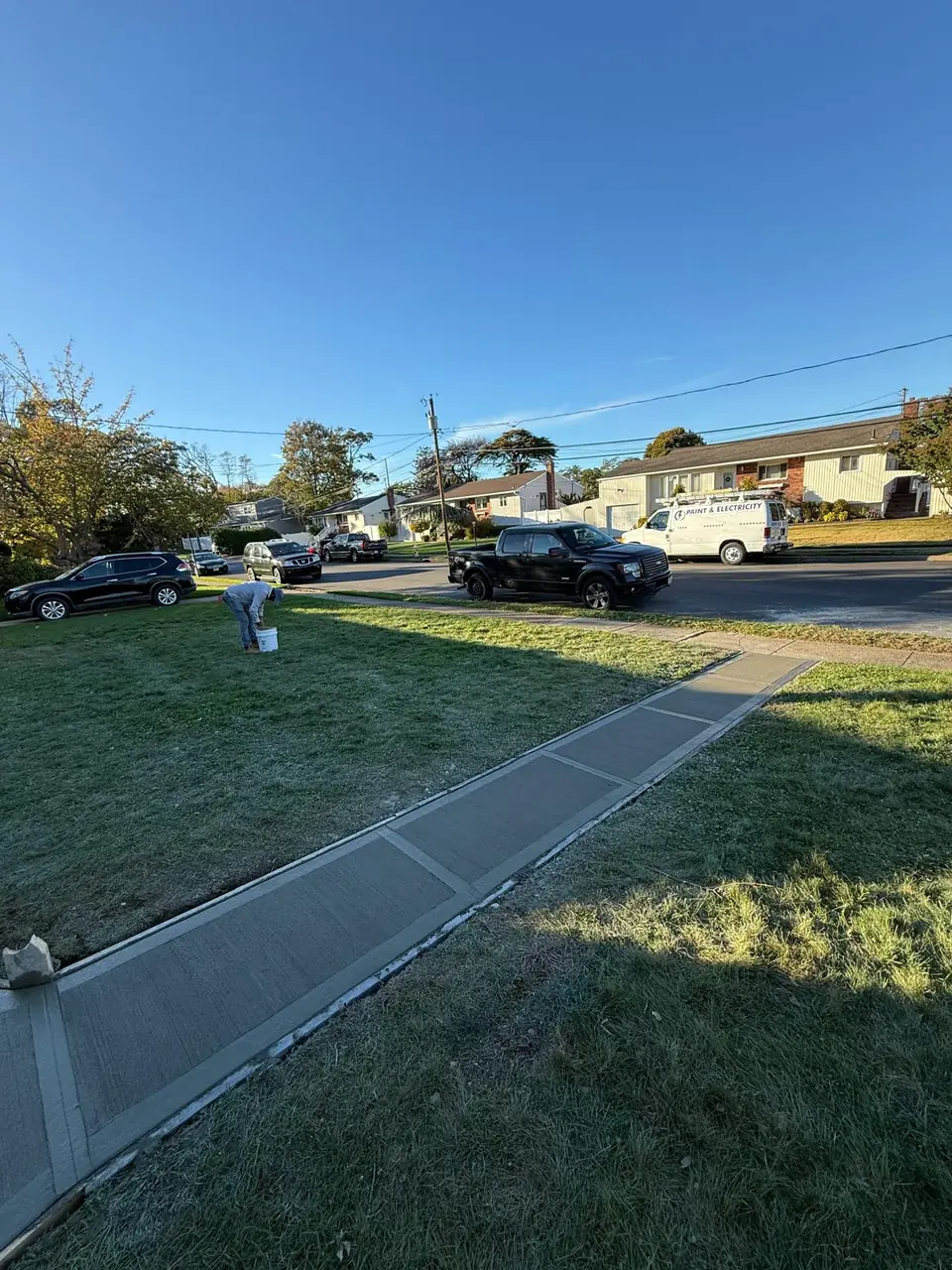 New residential sidewalk running along a front lawn